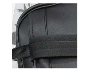 Detailed view of black business backpack with woven straps, durable and minimalist design.