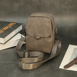 Stylish men's solid color vertical crossbody phone bag, casual versatile single shoulder mini bag.