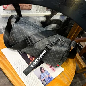 Men's trendy cylindrical single shoulder bag stylish messenger bag with monogram pattern.