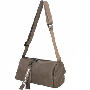 Trendy brown cylindrical men's shoulder crossbody bag with adjustable strap and casual design.