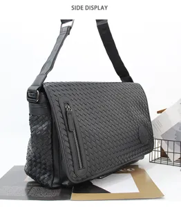 Detailed side view of black woven leather messenger bag for men, business casual crossbody.