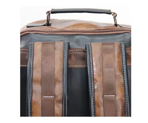 Detailed view of men vintage leather backpack, showing durable shoulder straps and top handle.
