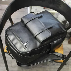 New large capacity black leather backpack, casual business computer bag and travel school bag.