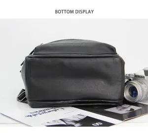 Bottom view detail of the black leather backpack showing durable base and neat stitching.