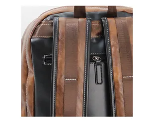 Close-up detail of vintage backpack back straps and zipper pocket with contrast design.
