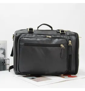 Close-up detail of black multi-functional travel backpack with multiple zip pockets.