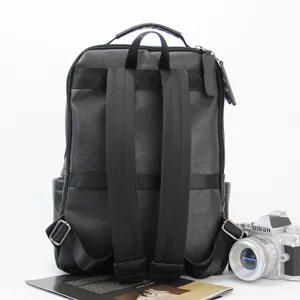 Black leather backpack for men, casual business computer rucksack with double shoulder straps.