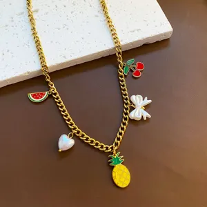 Gold titanium steel necklace featuring cute enamel fruit and bow charms for women and girls.