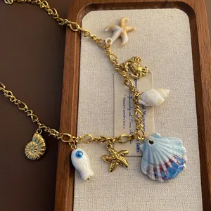 Ocean style DIY titanium steel charm necklace detail featuring seashell and starfish pendants.