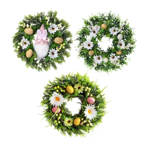 Easter wreath for front door with green leaves white daisies speckled eggs and cute bunny decor