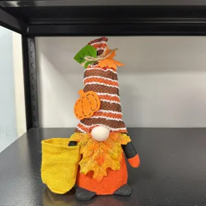 Thanksgiving autumn gnome plush doll with pumpkin maple leaf holding a small yellow bag.