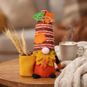 Cute Thanksgiving plush gnome doll with autumn pumpkin and maple leaf harvest festival decor.