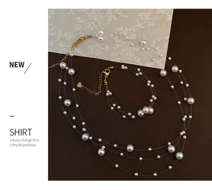 Set van meerlaagse parelketting en armband onzichtbare vislijn elegante sieraden