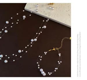 Multi-laagse parel ketting en armband set met vislijn elegante en stijlvolle sieraden