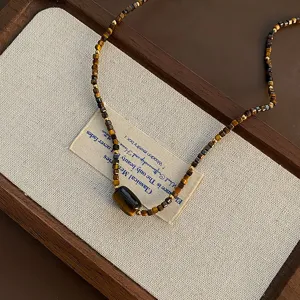 Vintage Tigerauge Perlenkette mit rechteckigem Anhänger, eleganter Schlüsselbeinschmuck.