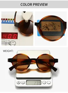 Vue detaillee de lunettes de soleil rondes polarisees avec monture ecaille et protection UV.
