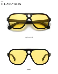 Retro Sonnenbrille mit schwarzem Gestell und gelben Gläsern, sechseckiger Metallsteg.