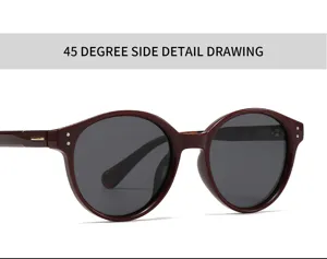 Vue détaillée des lunettes de soleil polarisées rondes rouge foncé montrant la construction.