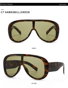 Oversized one-piece shield aviator sunglasses with tortoise shell frame and green tinted lenses.