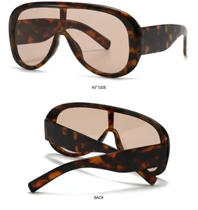 Detailed view of oversized tortoise shell shield sunglasses showcasing multi angle structure.
