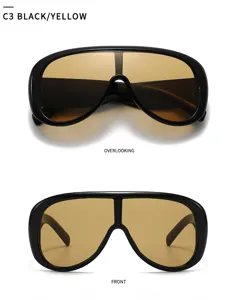 Detailed view of European style one-piece pilot sunglasses with wide black frame and yellow lens.
