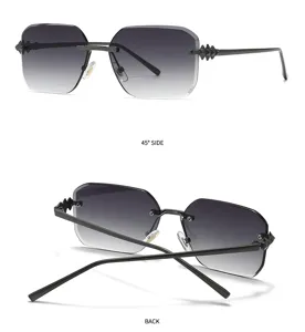 Lunettes de soleil carrées sans monture avec verres dégradés gris et branches cloutées uniques.