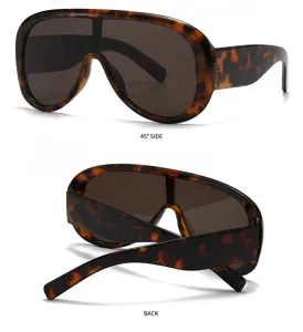 Oversized one-piece shield sunglasses with tortoise shell wide frame sun glasses detail.