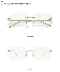 Lunettes de soleil carrées sans monture de luxe pour femmes avec branches dorées.