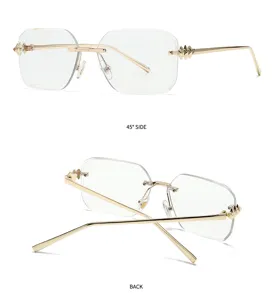 Lunettes de soleil carrées sans monture pour femmes dorées avec branches à clous élégantes.