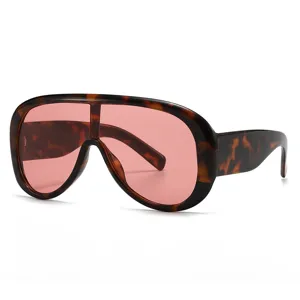 Oversized one-piece shield sunglasses with tortoise shell frame and pink tinted lenses.