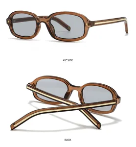 Gafas de sol vintage marrones con montura cuadrada, lentes grises y detalles dorados.