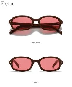 Gafas de sol retro de montura pequeña con lentes rojas y diseño elegante y moderno.