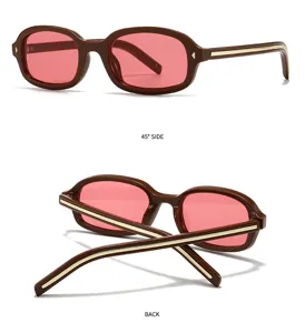 Gafas de sol cuadradas retro con montura marrón lentes rosas y detalles dorados.