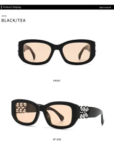 Elegante schwarze Sonnenbrille mit Nieten und braunen Gläsern für Damen im Retro Look.