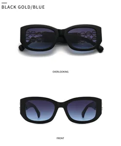 Modische Barock Sonnenbrille mit Farbverlauf in Blau und elegantem schwarzen Gestell.