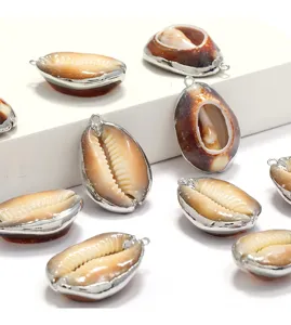 Close-up of electroplated silver edge seashell pendant charms, natural shell jewelry making.