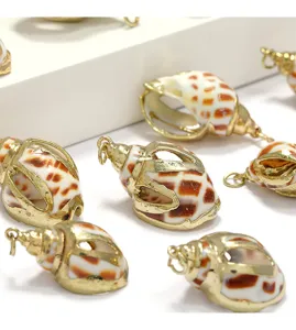 Detailed close-up of gold-edged sea shell pendants, perfect for DIY jewelry making accessories.
