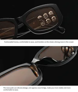 Detailaufnahme einer schwarzen Vintage-Sonnenbrille mit Metallbeschlägen und Nasenpaddeln.