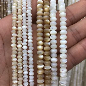 Natural mother of pearl shell bead strands, perfect for DIY handmade jewelry crafting.