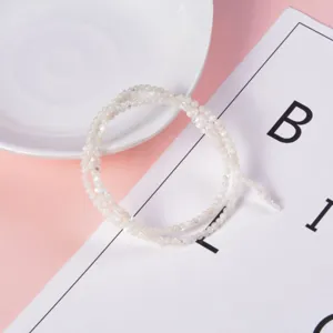 Close-up detail view of white mother-of-pearl round beads, perfect for DIY jewelry making.