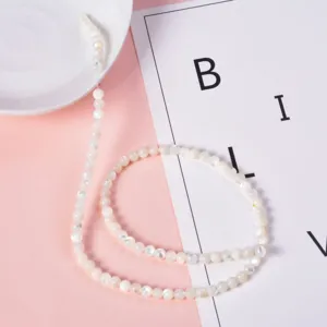 White mother of pearl shell round beads close-up detail for custom DIY handmade jewelry design.