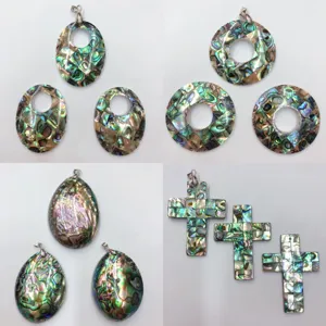 Detailed view of colorful abalone shell mosaic pendants in various geometric shapes.