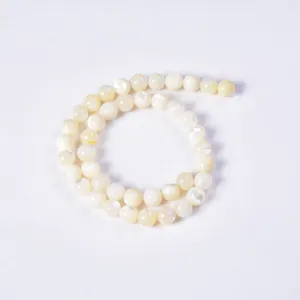 White mother-of-pearl shell round beads detail for DIY jewelry making and accessories.
