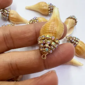 Detail view of rhinestone conch shell pendant, bohemian beach style DIY necklace jewelry charm.