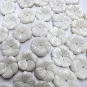 Natural shell carved flower beads detail shot, five petal bowl shape with center hole DIY.