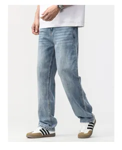 Detail view of men's loose straight-leg retro jeans in light blue denim wash finish