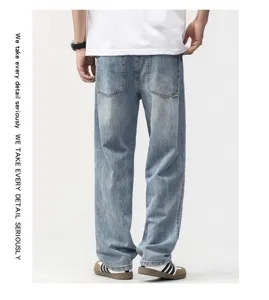 Detailed back view of men's loose straight wide-leg denim jeans in light blue wash style