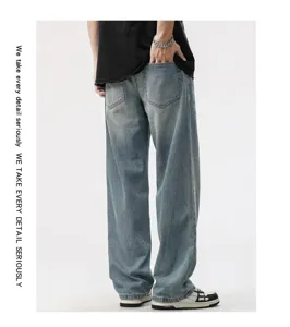 Detailed back view of men's loose wide-leg jeans with vintage washed denim texture