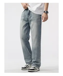 Detail view of men's loose straight wide-leg retro denim jeans in light blue wash
