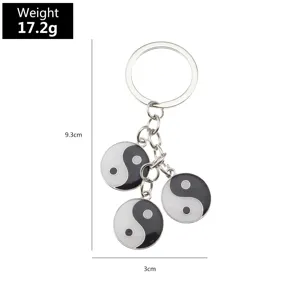 Detail view of metal yin yang keychain featuring dimension specs and lightweight 17.2g design.